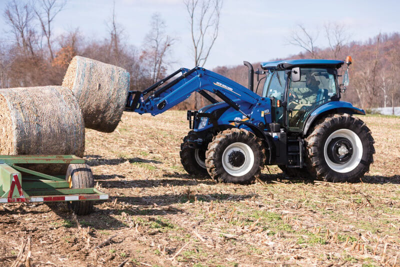 tractor lifting bales