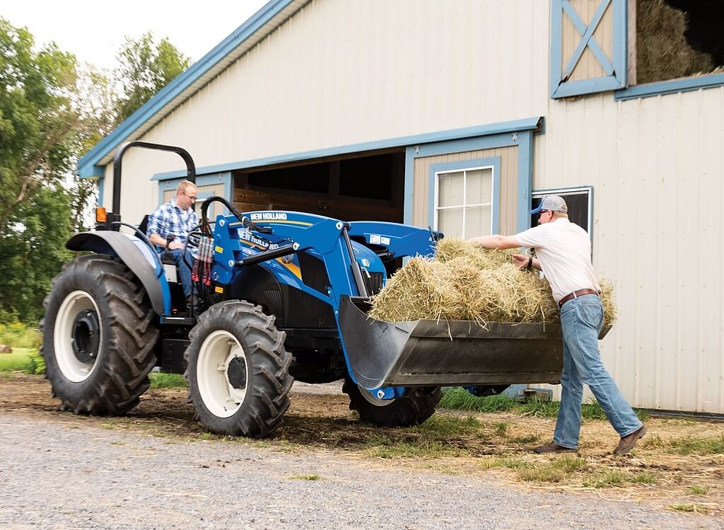 tractor with bales in bucket